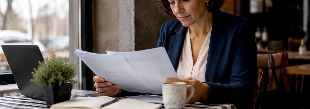 Business owner reviewing outsourcing documents