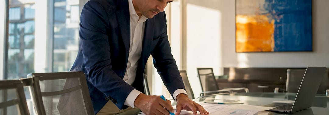 Finance manager reviewing labor cost documents