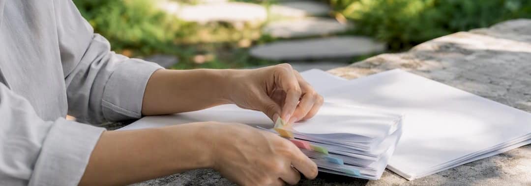 Hands performing payroll compliance audit